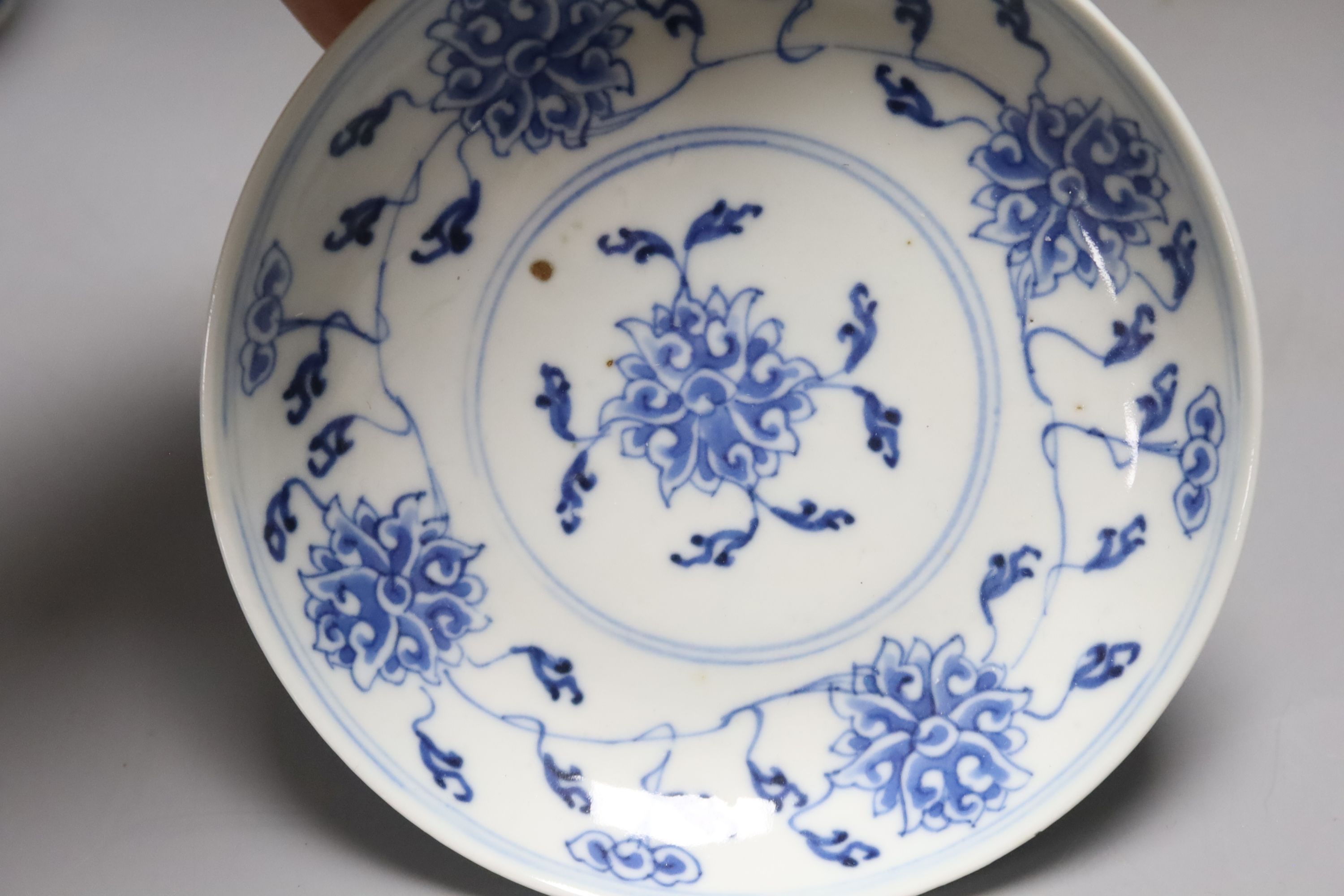 Two Chinese blue and white vases and a dish, together with a famille rose dish, tallest 28cm